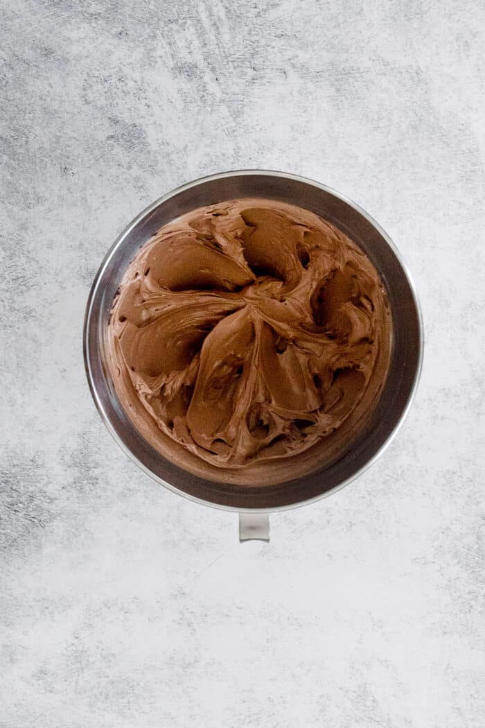 This lighter-than-air French silk pie recipe with 2 types of chocolate, espresso, and a salted pecan crust is a decadent holiday treat. Chocolate filling in the mixing bowl.