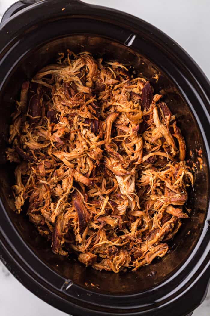 Shredded orange chicken in the slow cooker