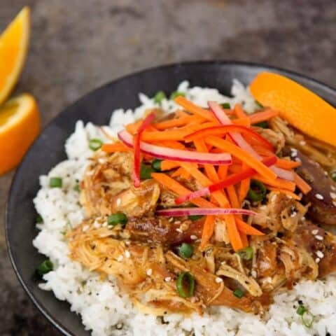 orange chicken and vegetable rice bowl