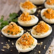 a serving board of Deviled Eggs topped with Garlic Toast Crumbs