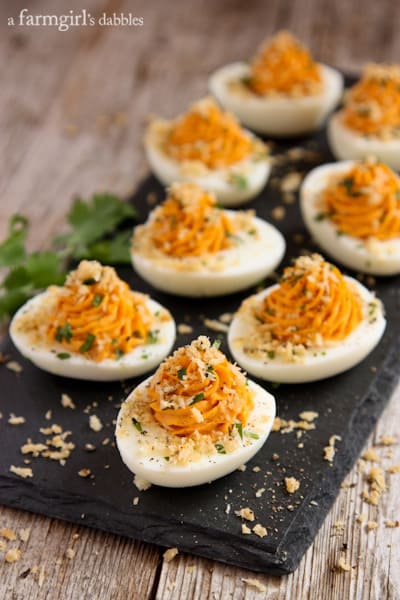 a serving board of Deviled Eggs topped with Garlic Toast Crumbs