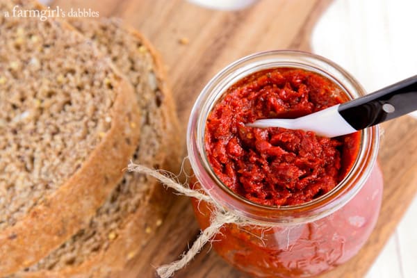 while grain bread and a jar of Tomato Spread