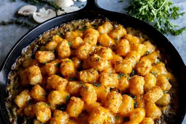 a cast iron skillet of tater tot hotdish