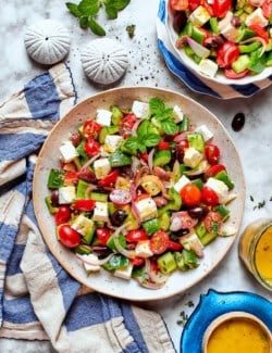 Overhead view of Greek chopped salad in two bowls