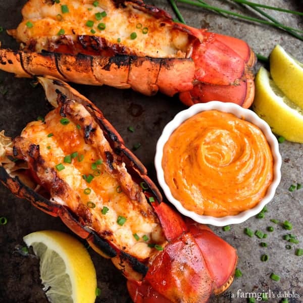 Grilled Lobster Tails with a dish of Sriracha Butter