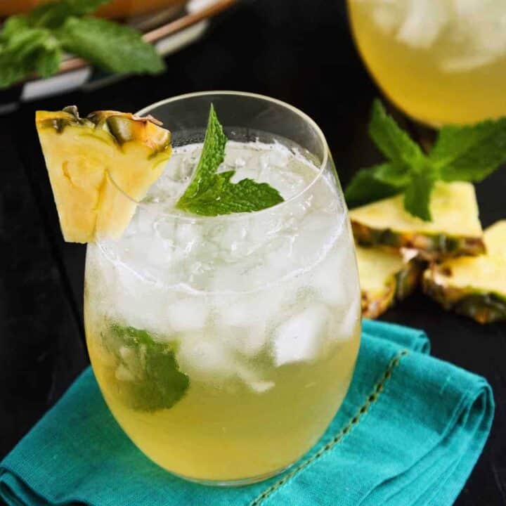 a glass of pineapple mint julep sangria