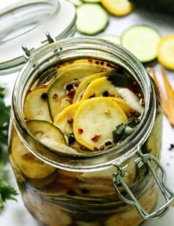 slices of squash pickles in a jar
