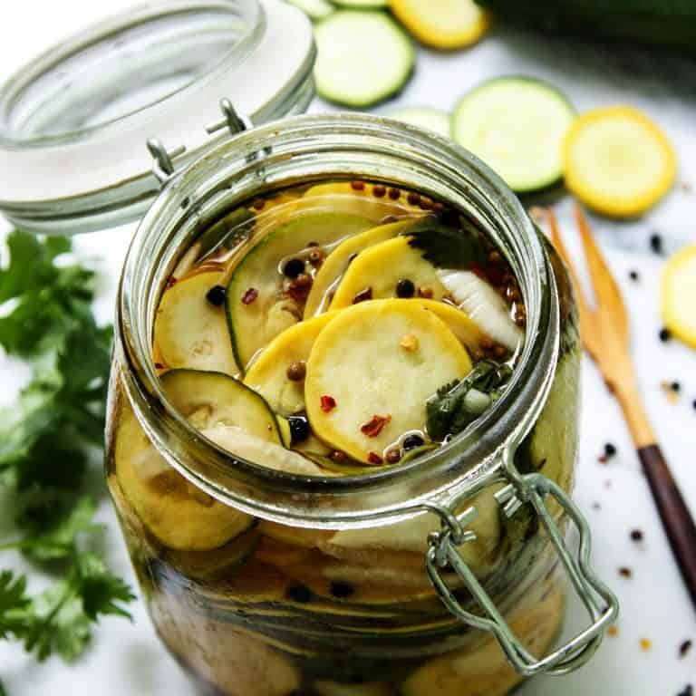 slices of squash pickles in a jar