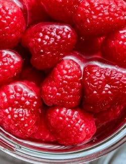 Raspberries in jar of vinegar.