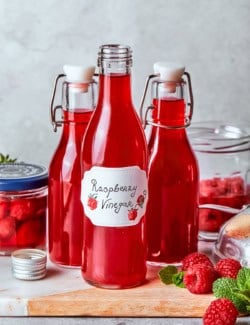3 bottles of homemade raspberry vinegar.