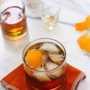 Old Fashioned Bacon Bourbon in a Clear Glass on the Counter