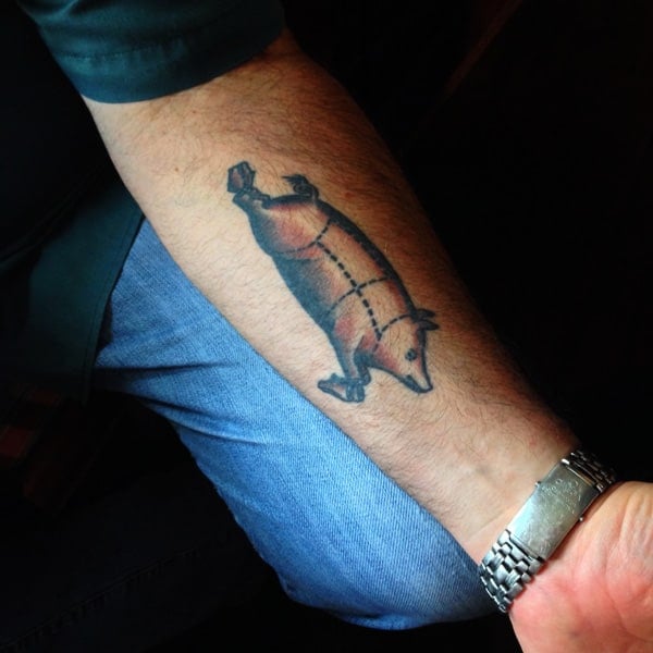 A Pig Tattoo on a Man's Forearm