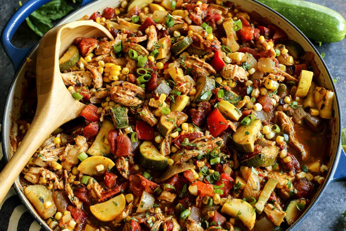 End of Summer Chicken Chili with a wood serving spoon