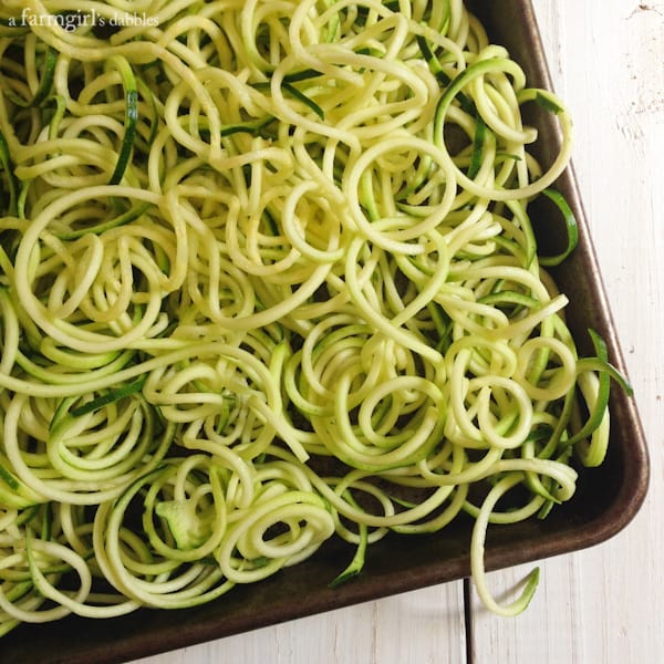 Zucchini Noodles on a rimmed baking pan