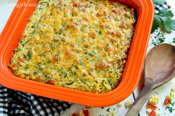 Cheesy Zucchini Noodles Baked with Roasted Corn and Red Pepper in a baking pan