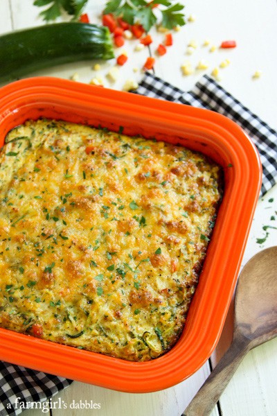 an orange, square baking pan of Zucchini Noodles Bake