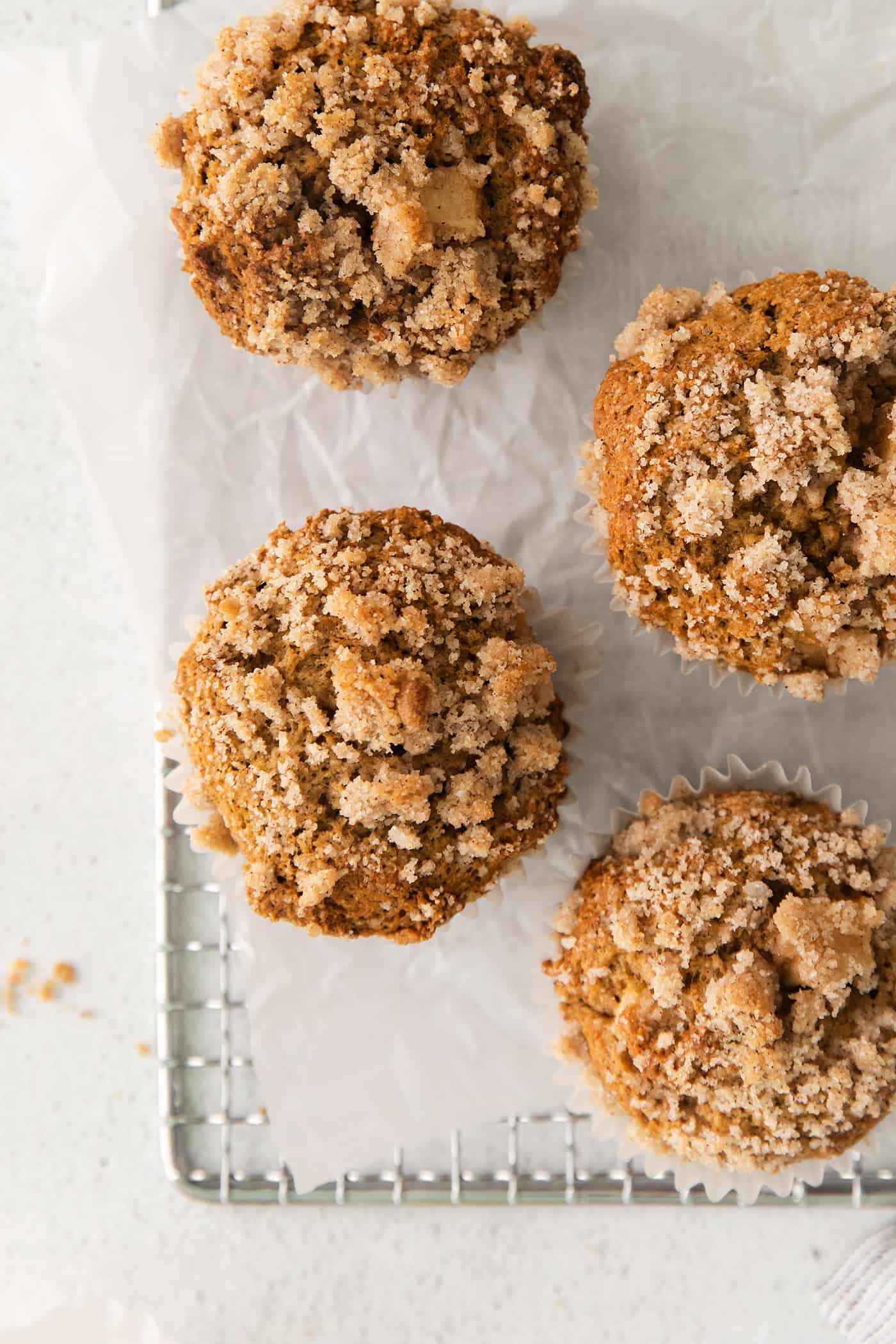 Overhead view of apple muffins with crumb topping