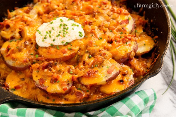 sour cream and chives on top of skillet potatoes