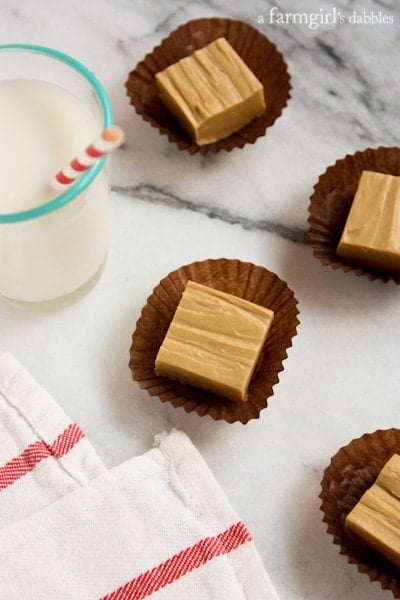 Peanut Butter Fudge squares on paper wrappers