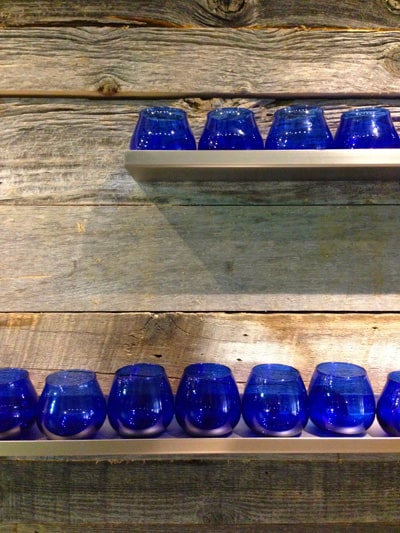 a row of cobalt blue glasses