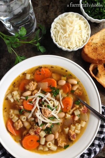 Italian Chicken Sausage Soup in a bowl with fresh parsley