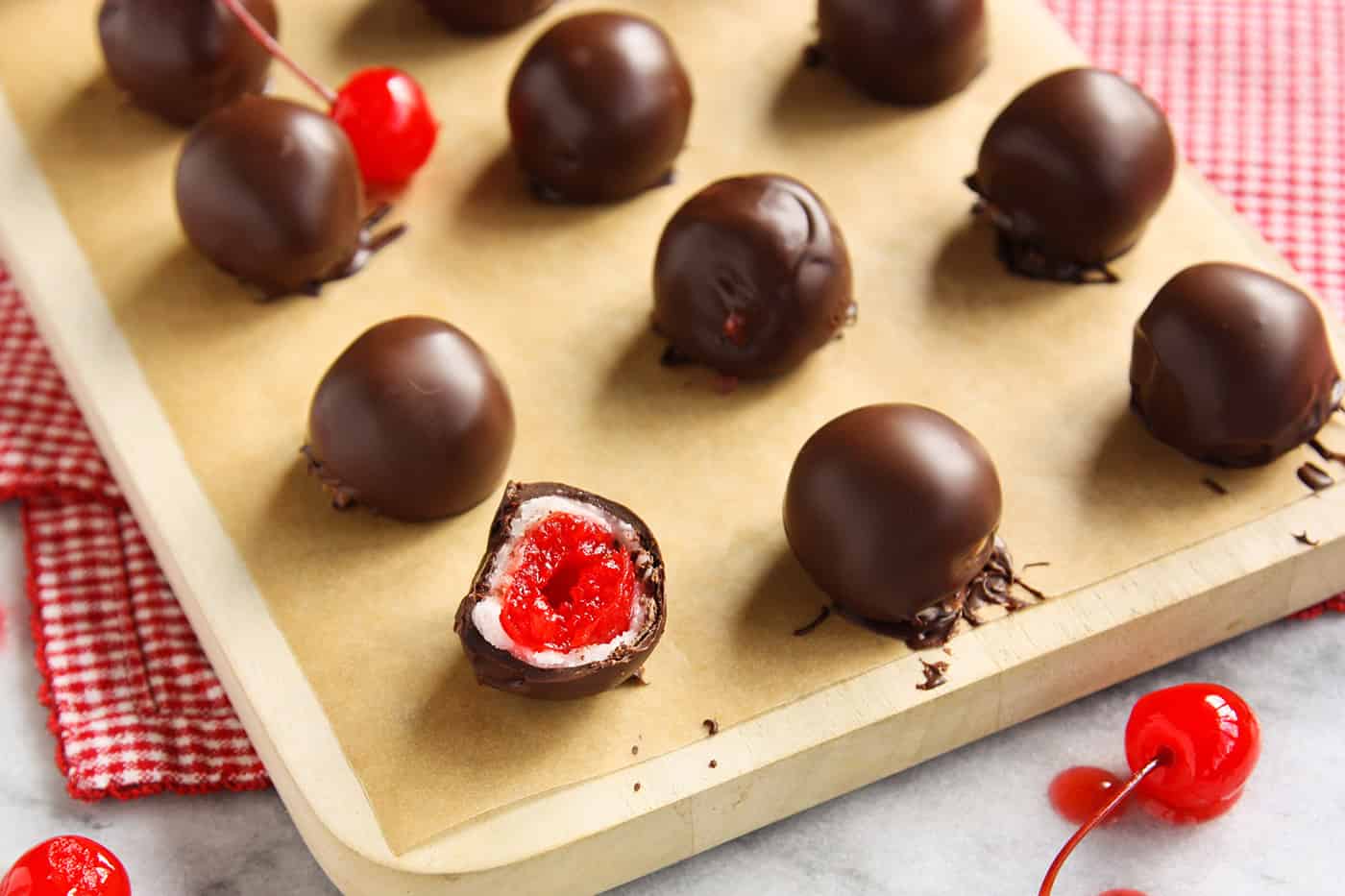 Chocolate covered cherry cordials on a baking sheet