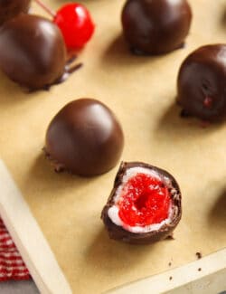 Chocolate covered cherry cordials on a baking sheet