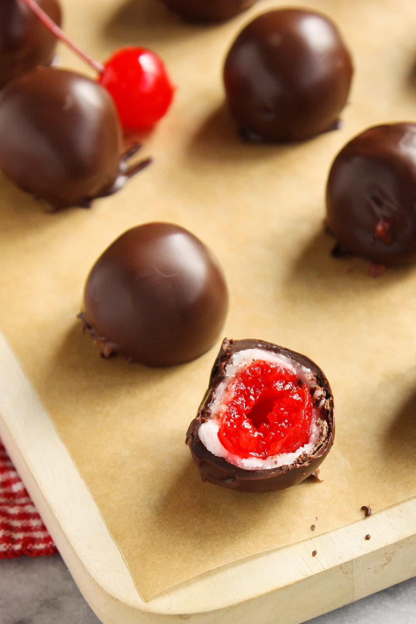 Chocolate covered cherry cordials on a baking sheet