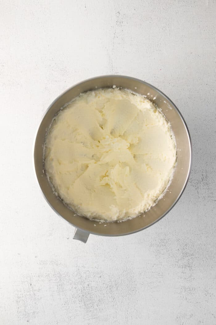 Whipped butter and sugar in a mixing bowl