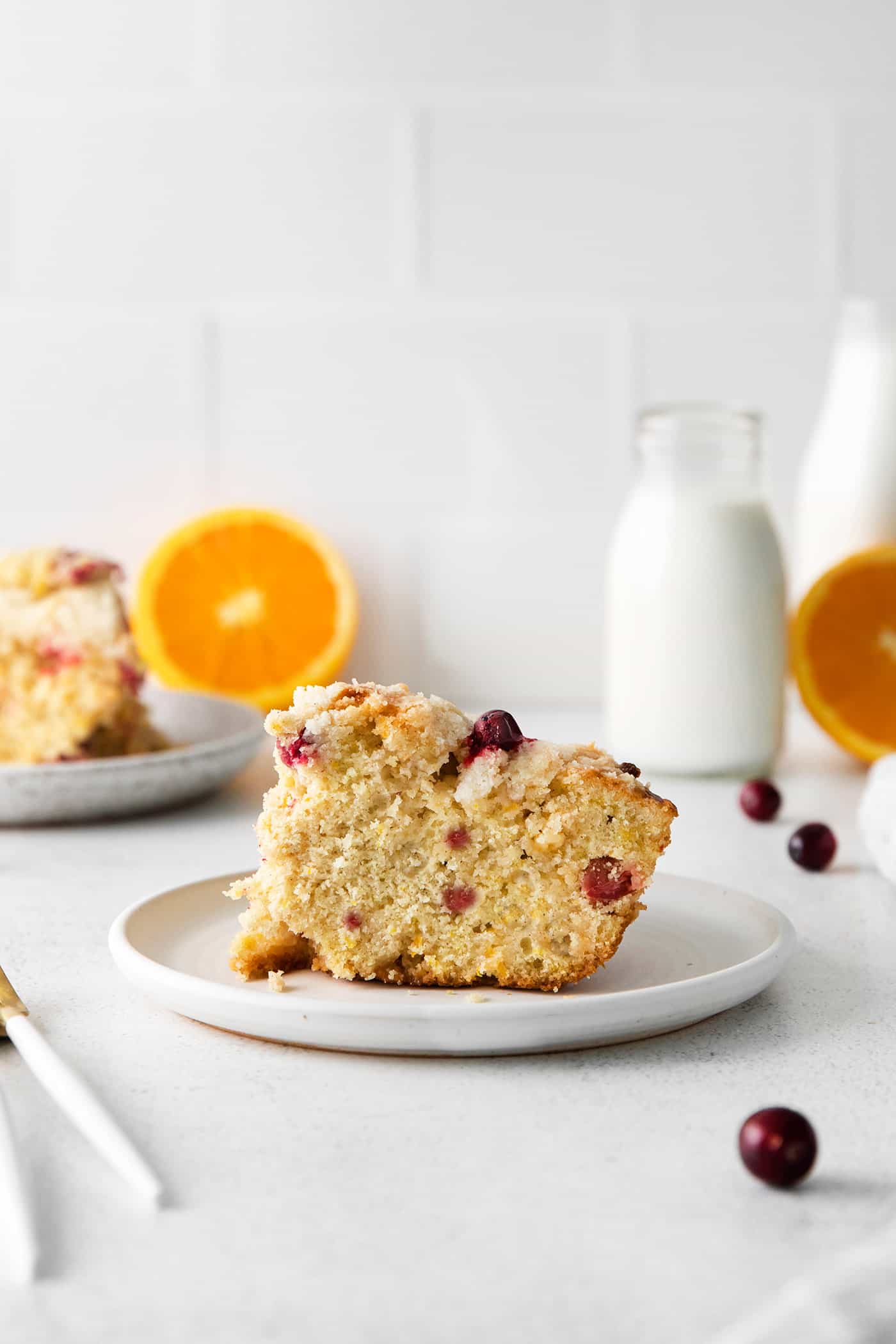 A slice of cranberry orange skillet cake on a plate