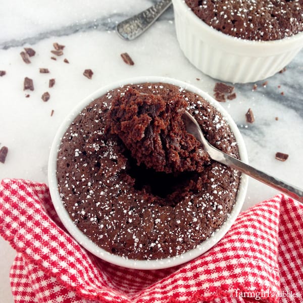 a spoonful taken out of a Chocolate Cake Cup