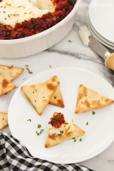 Baked Goat Cheese dip spread on a cracker