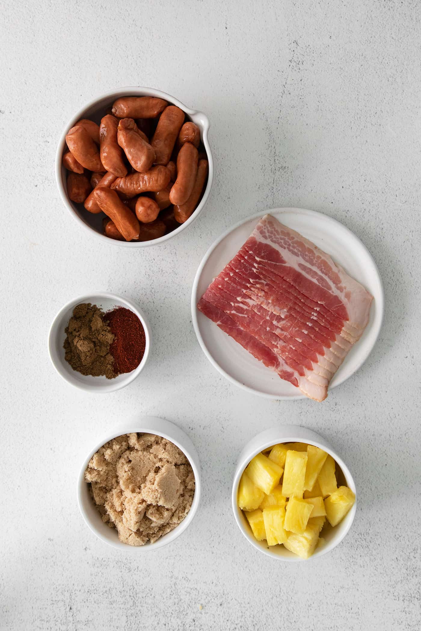 Ingredients to make bacon wrapped smokies with pineapple