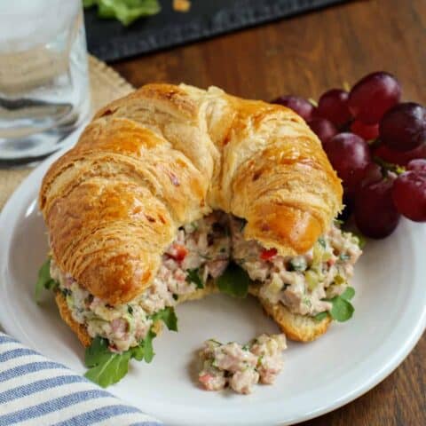 Herby Ham Salad sandwich on a white plate