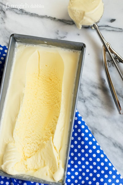 Crème Fraîche Ice Cream in a bread pan with a scoop taken out