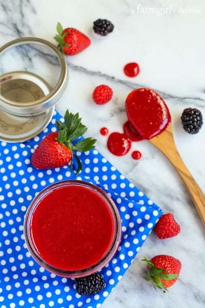 Triple Berry Sauce in a glass jar