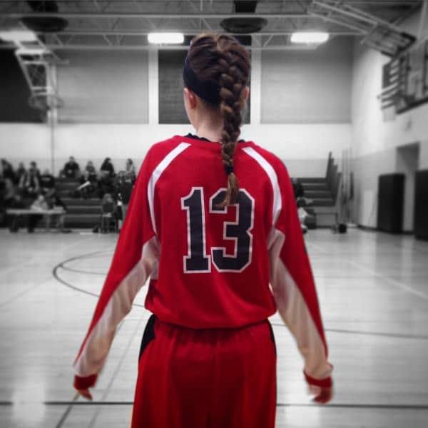 a girl in a basketball uniform