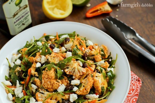 A white bowl of cauliflower salad