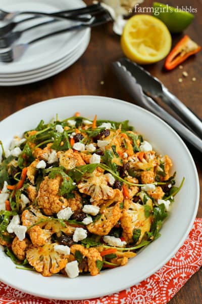 North African Cauliflower Salad topped with charmoula dressing, feta and raisins 