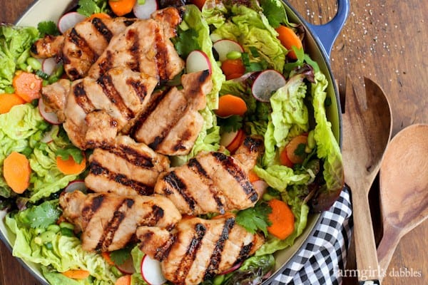 Grilled Pork Tenderloin with lettuce, carrots, and radishes