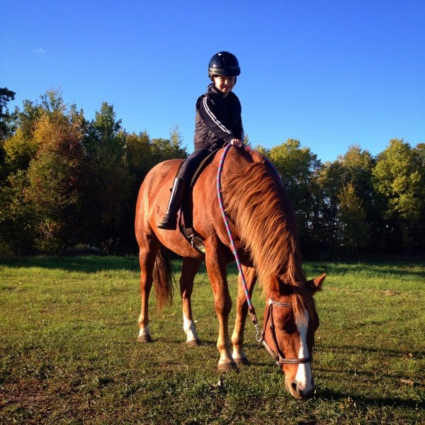 a girl riding a horse