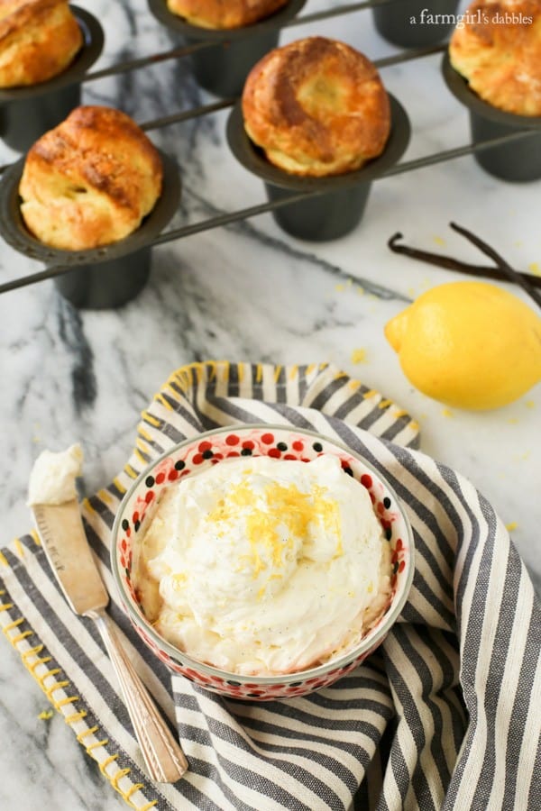Whipped Lemon-Vanilla Bean Butter in a bowl with a pan of popovers