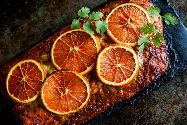 Grilled salmon with orange slices and chipotle