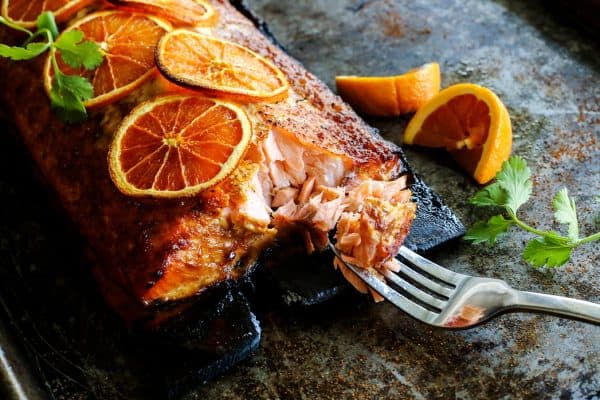 Grilled salmon with a forkful taken out