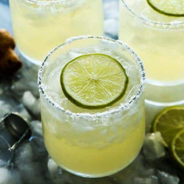 glasses of prosecco margaritas with fresh lime slices
