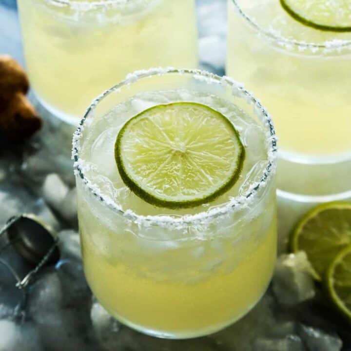 glasses of prosecco margaritas with fresh lime slices