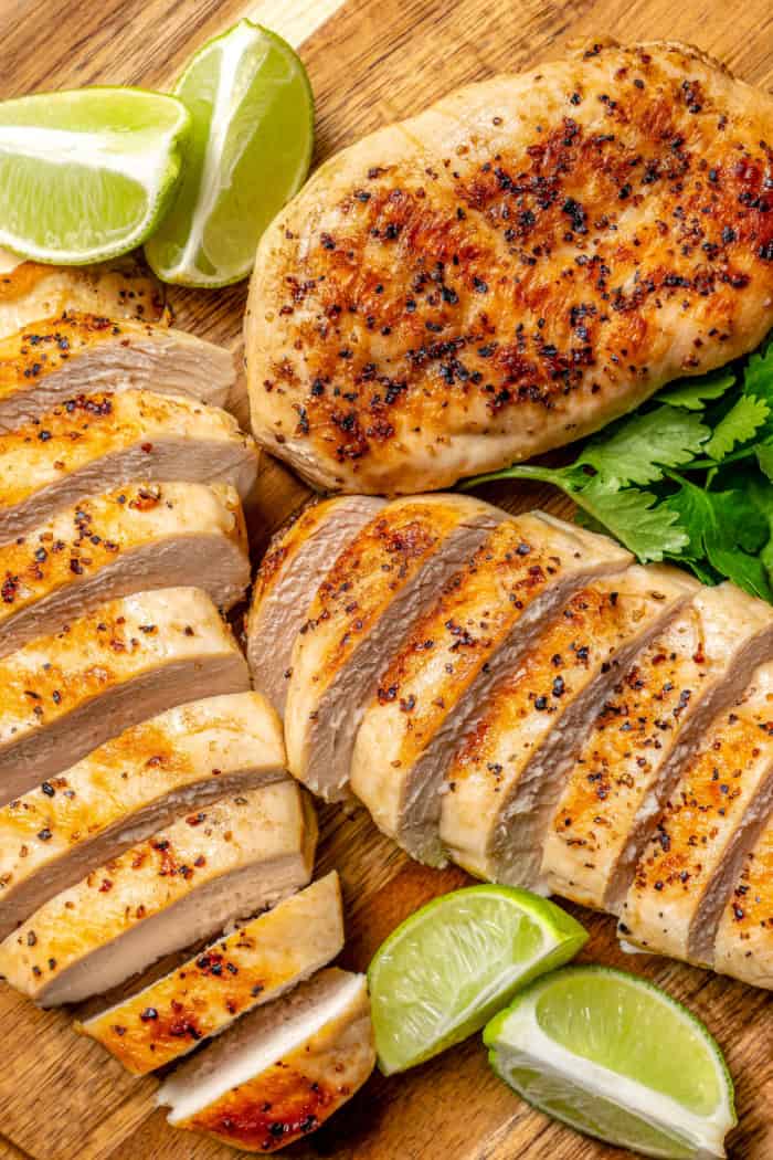 Overhead view of sliced grilled chicken breasts