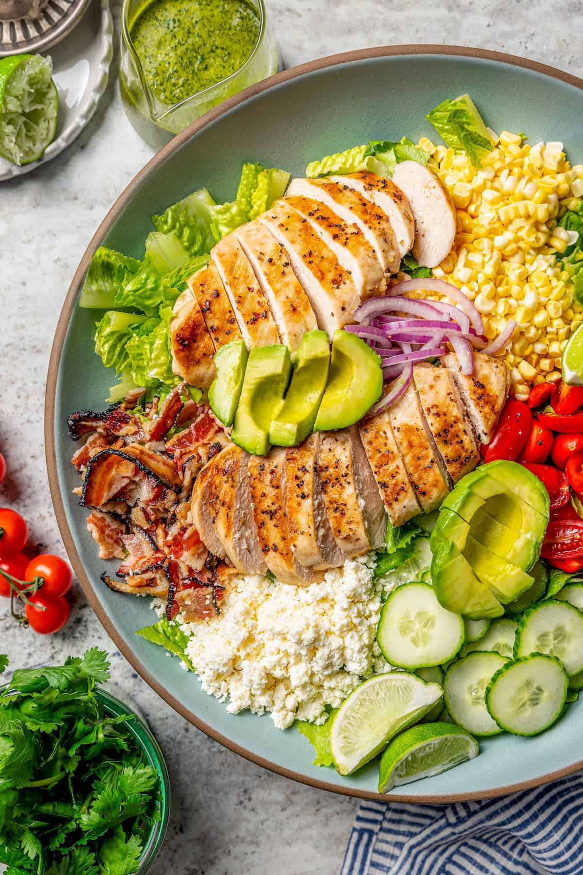Overhead view of grilled chicken salad on platter