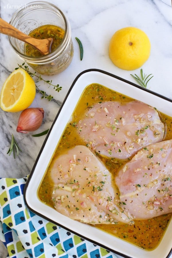 chicken breasts in a pan of marinade