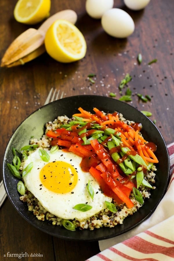 a bowl of quinoa with eggs and vegetables